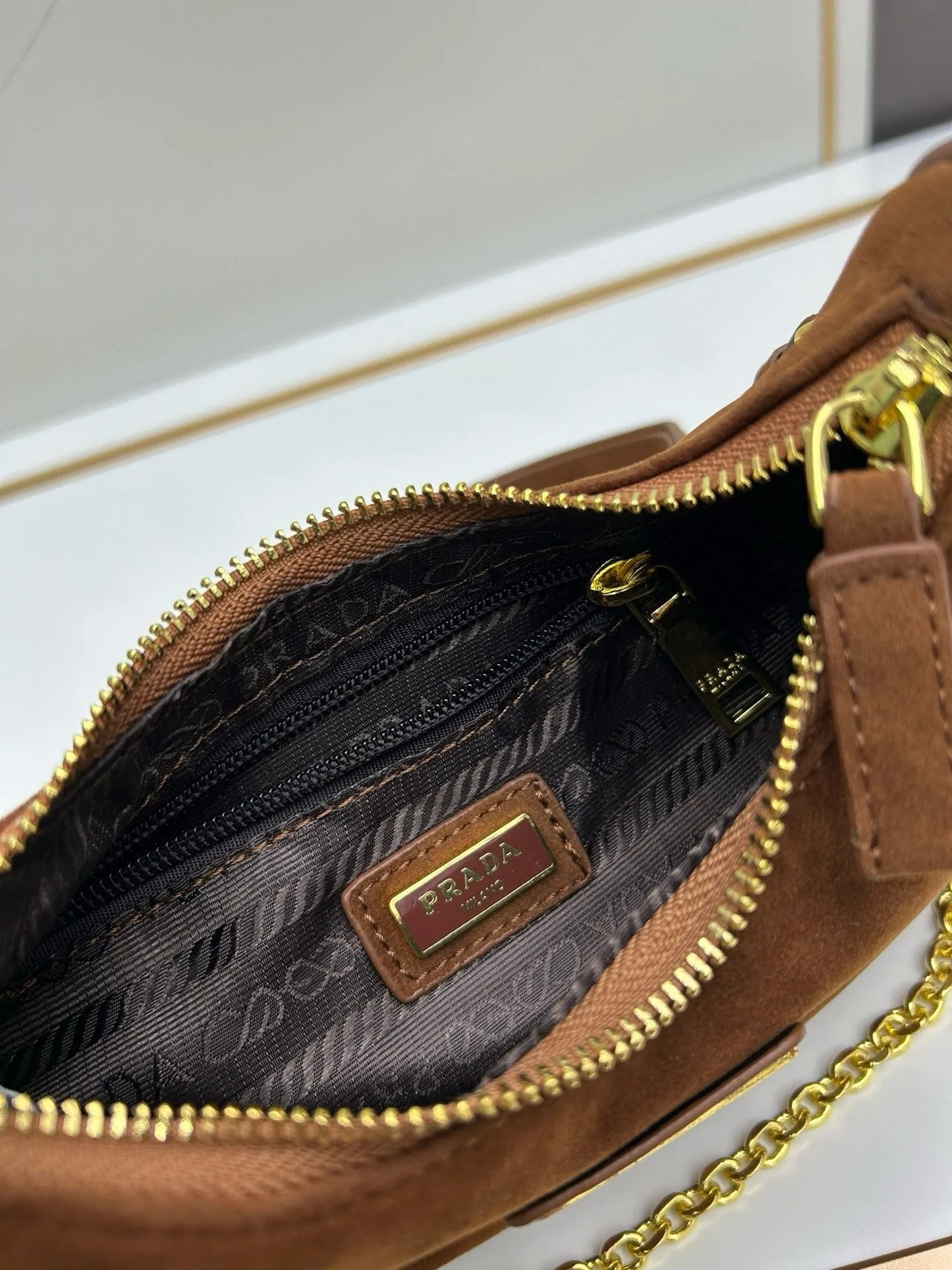 P Re-Edition Suede Mini Bag