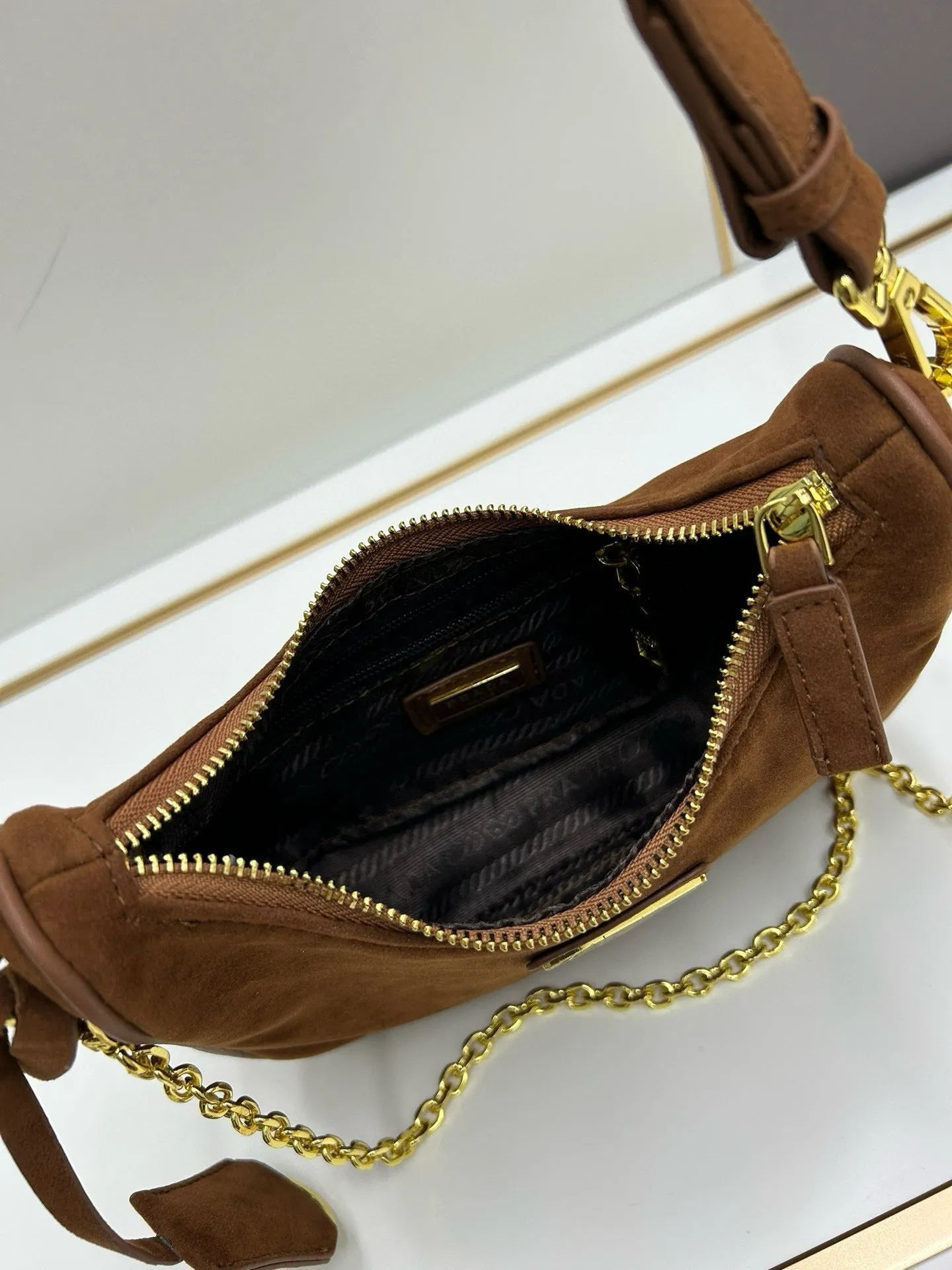 P Re-Edition Suede Mini Bag